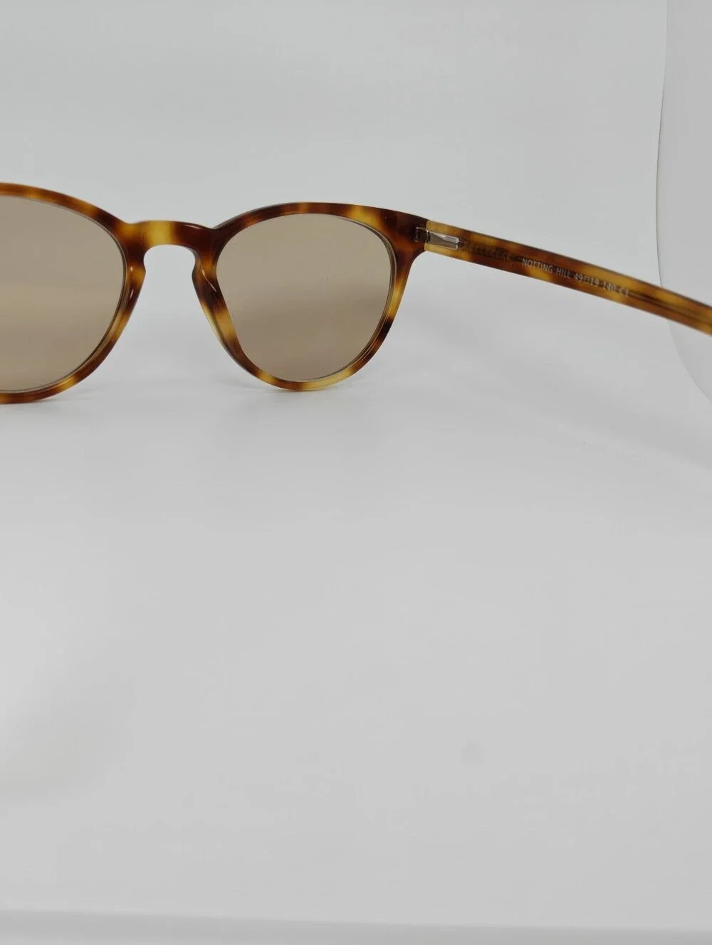 Notting Hill. Feminine. Tortoiseshell Round. Slight Cat Eye Shape.